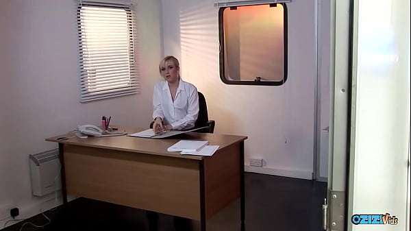 There is something about this beautiful blonde secretary in black stockings that will make every man lose his mind.