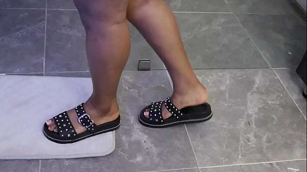 Volubtuous black woman shows her tits in the bathroom